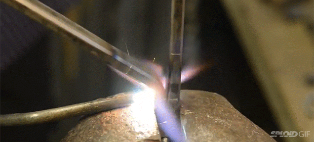 Silversmith forging metal