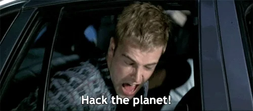 Scene from the movie &quot;hackers&quot;. Zero Cool sticking his head out the window of a cop car screaming &quot;hack the planet&quot;.