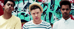three young guys nodding heads rapidly