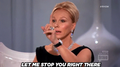 A man raises a hand and says stop, cutting someone off mid-sentence.