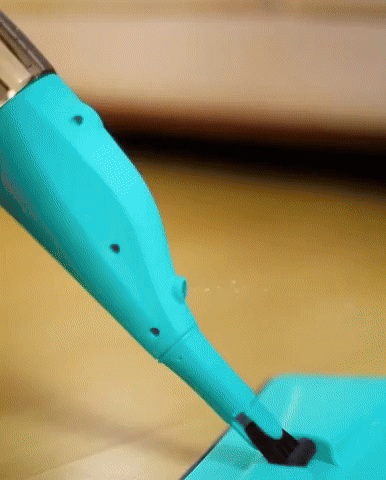 Animated GIF showing a spray mop in action, highlighting the fan-shaped spray mist
