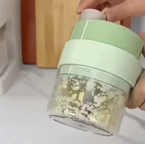 Cordless food mincer chopping garlic and ginger