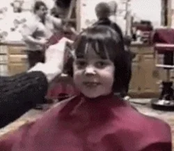 Hairdresser cutting a client's hair in a salon